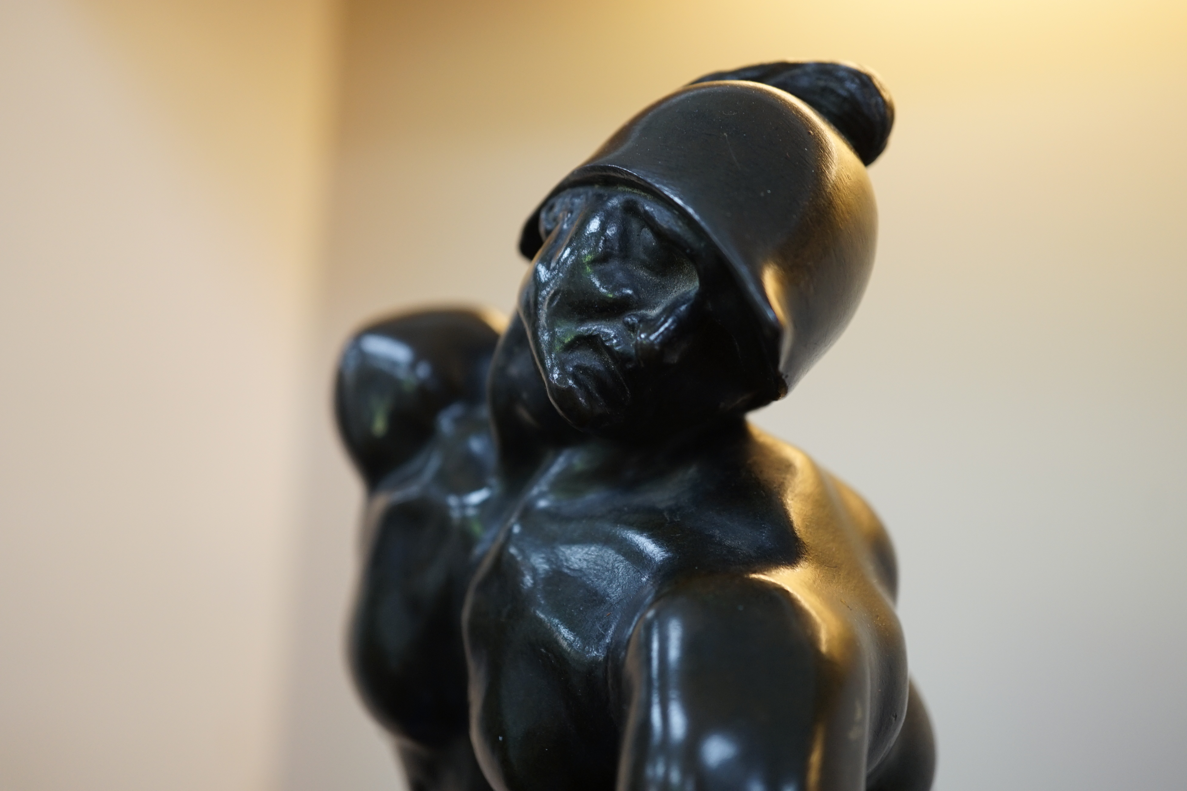 After the antique, a pair of late 18th/early 19th century Grand Tour souvenir bronze figures of seated warriors